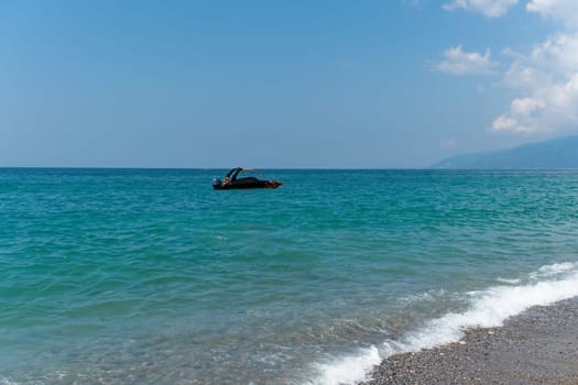 Amazing view of sea surface landscape at Gagra Abkhazia resort with blue sky as background. Calm waves and turquoise sea tranquility in paradise. Travel at vacation and tourism concept.