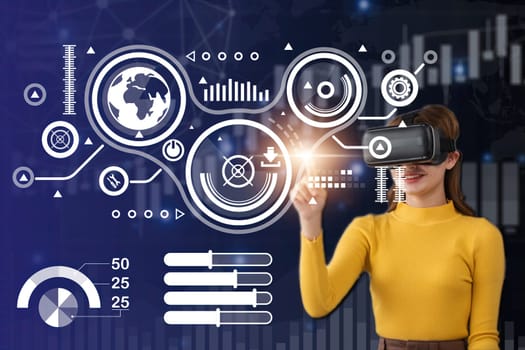 Smiling businesswoman in casual wear is wearing vr helmet. Pie diagrams with finance graph analysis diagram. Dark blue background. Concept of virtual reality and successful business.