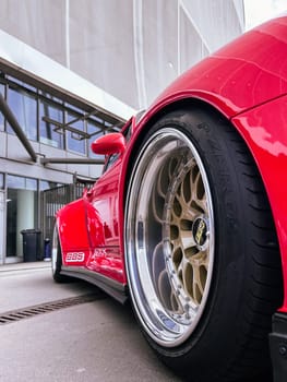 Fragment of a Red sport car, wheel BBS disk Close-up