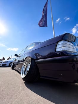 Black car silver Porsche disk wheel close up. High quality photo