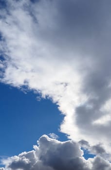 a large white cloud in a blue sky