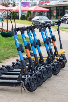 Belarus, Minsk - 20 september, 2023: A row of rental electric scooters on the pavement