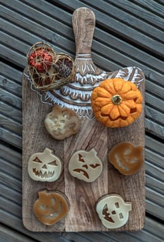 Delicious pumpkin ghost made with Agar powder and Halloween pumpkin. Tasty jelly in the shaped of cute ghost pumpkin. Celebrate with Halloween holiday, Pumpkin demon, Top view, Copy space, Selective focus.