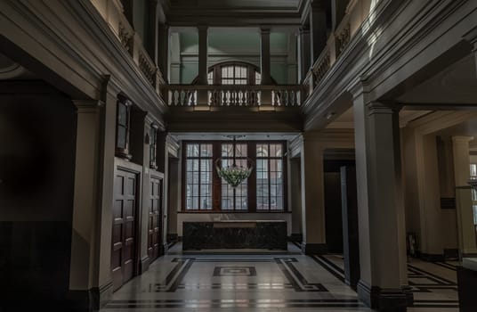 London, UK - Nov 01, 2023 - Beautiful interior architecture design. The room is Vintage dark tone to reveal the primacy of the central structure with ‘Exhale’ the world’s first living bionic chandelier which purifies the air indoors of Victoria and Albert Museum.