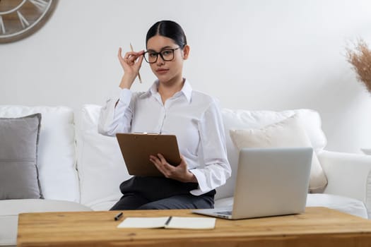 Psychologist woman in clinic office professional portrait with friendly smile feeling inviting for patient to visit the psychologist. The experienced and confident psychologist is uttermost specialist