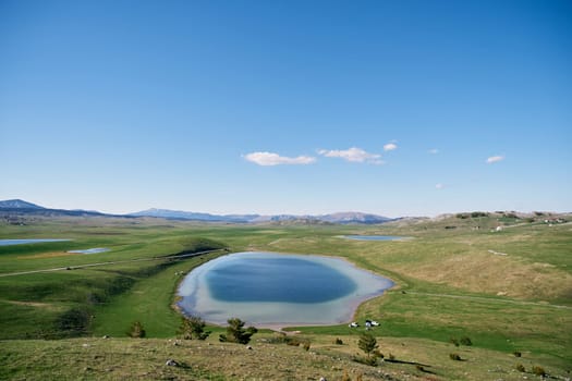 Blue Devil Lake in a green valley in Durmitor National Park. Montenegro. High quality photo