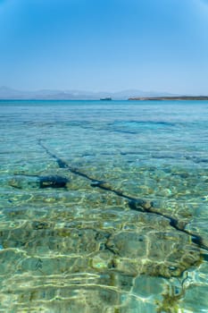 Transparent waters on a beach in Paros