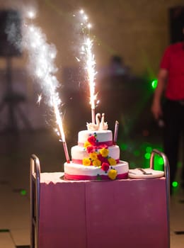 A traditional and decorative wedding cake at wedding reception.