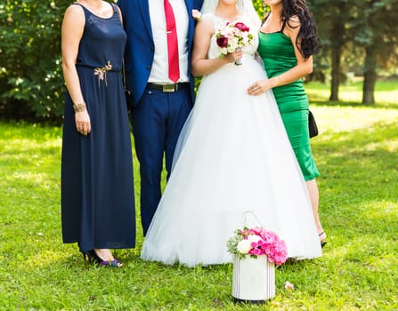 Friends of bride and groom on the wedding ceremony outdoors