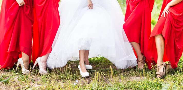 Bride and bridesmaids legs. Wedding party. Wedding guests