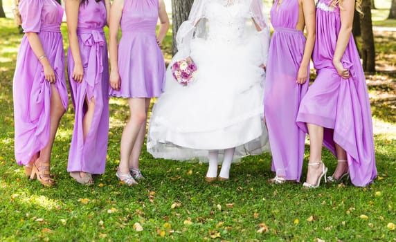 Bride and bridesmaids legs. Wedding party. Wedding guests