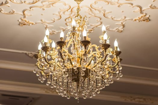 beautiful crystal chandelier in a room. lamp