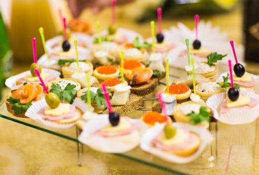 Canapes and appetizers on the festive table