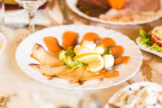 Snack of sliced red fish. Festive table