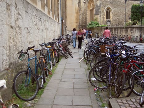 View of bicycles lined up on racks in Oxford, England, UK.