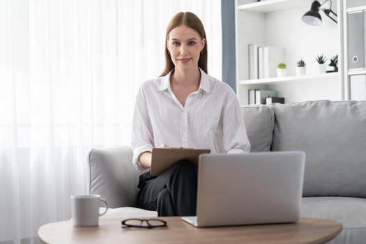 Psychologist woman in clinic office professional portrait with friendly smile feeling inviting for patient to visit the psychologist. The experienced and confident psychologist is utmost specialist