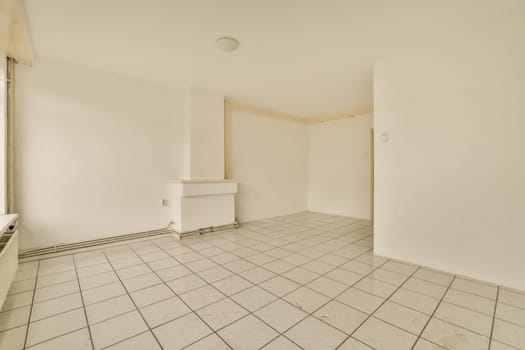 an empty room with white walls and tile flooring on the floor, there is no one person in it