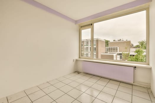 an empty room with white tiles and purple trim around the window panes, looking out onto the street below