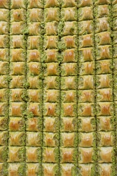 baklava pieces with syrup and peanut .