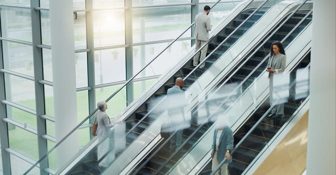 Business people, elevator and travel with office and international trip with lens flare. Corporate, professional on escalator and appointment with conference, stairs for convention and executives.