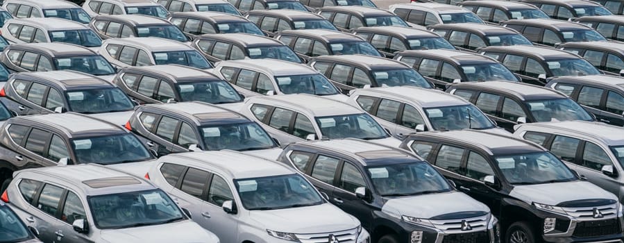 Lamchabang, Thailand - July 02, 2023 From the factory to the world, Brand new cars in a crowded warehouse await parking and transportationa testament to modern industry.