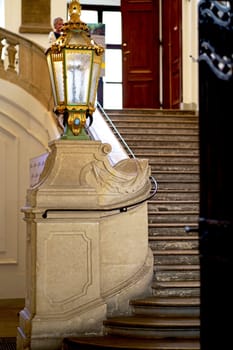 Decorated entrance to the famous Prunksaal or State Hall of the Austrian National Library in the Hofburg. Beautiful light staircase with a lantern