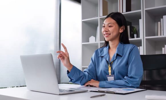 Business woman using calculator for do math finance on wooden desk in office and business working background, tax, accounting, statistics and analytic research concept..