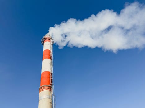 a chimney on a blue sky background. photo