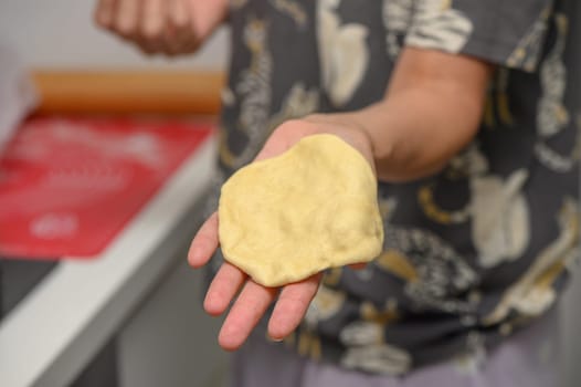 woman making buns in the kitchen 2