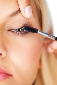 Makeup, mascara and woman with hands in studio for volume, care or professional application closeup. Eyelash extension, beauty and eyes of model with beautician for glam, texture or transformation.