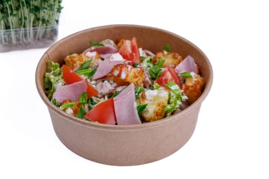 Salad with ham on a white background, for a food delivery site