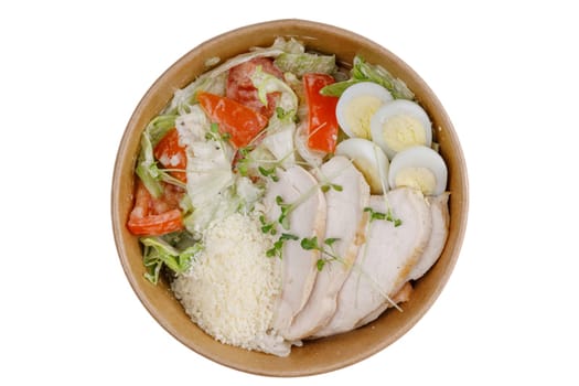 Caesar salad with chicken on a white background