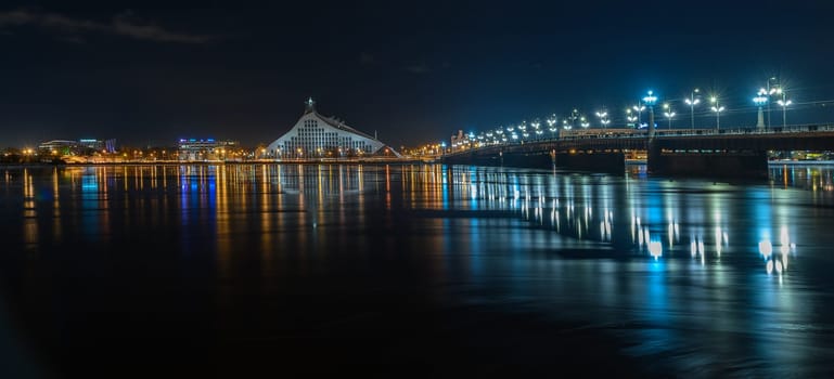 National Royal Library of Latvia in Riga view at night across the river