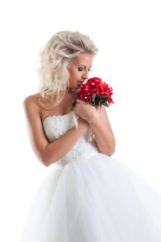 Image of romantic blond bride cuddles bouquet
