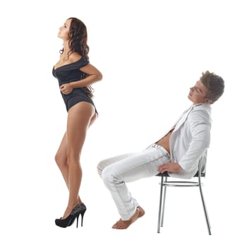 Relaxed man looking at sexy girl dancing, isolated on white