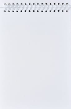 Open spiral notepad with blank white sheets. Copy space