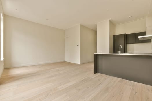 an empty living room with wood flooring and white walls in the room is very clean, but it's hard to see