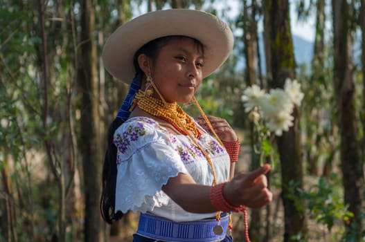 young indigenous woman enamored with a bouquet of white flowers in her hand dressed in gala clothes on Valentine's Day. High quality photo