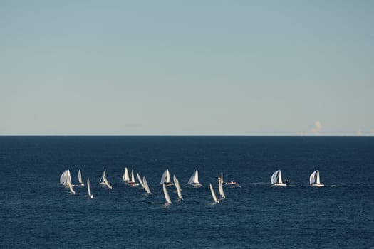 A lot of sail boats and yachts in the sea went on a sailing trip near port Hercules in Monaco, Monte Carlo, sail regatta, race. High quality photo