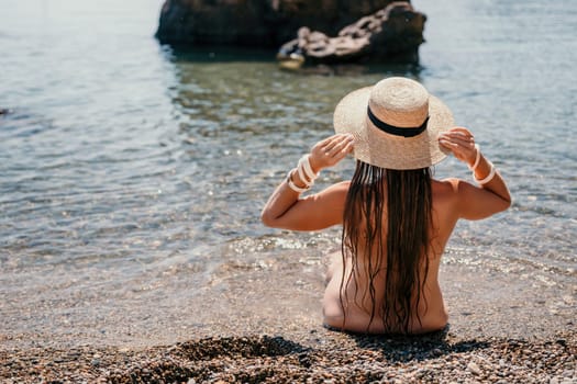 Woman travel sea. Happy tourist taking picture outdoors for memories. Woman traveler looks at the edge of the cliff on the sea bay of mountains, sharing travel adventure journey.