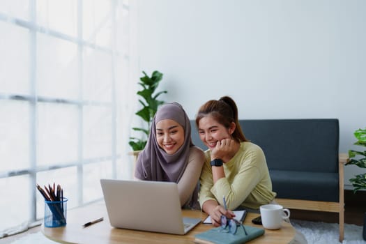 Muslim undergraduates and Asian women are studying online using computers