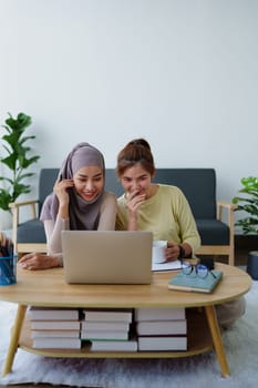 Muslim undergraduates and Asian women are studying online using computers