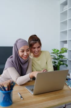 Muslim undergraduates and Asian women are studying online using computers