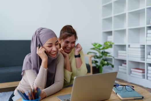 Muslim undergraduates and Asian women are studying online using computers