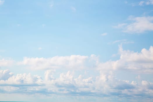 Blue sky background with clouds. Beauty clear cloudy sunshine calm bright texture. Vivid cyan landscape in spring day environment