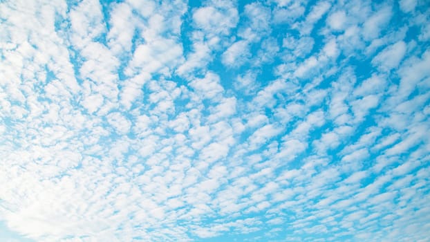 Blue sky background with clouds. Beauty clear cloudy sunshine calm bright texture. Vivid cyan landscape in spring day environment