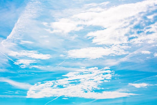 Blue sky background with clouds. Beauty clear cloudy sunshine calm bright texture. Vivid cyan landscape in spring day environment