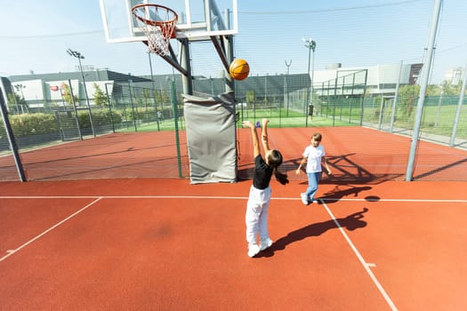 girls playing basketball on the basketball court. High quality photo