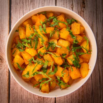 LEBANESE RECIPE FOR SPICY POTATOES, BATTATA HARA, GARLIC, CORIANDER AND PAPRIKA. High quality photo