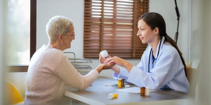 doctor discussion results or symptoms and gives a recommendation to a senior women patient, giving consultation during medical examination in clinic.